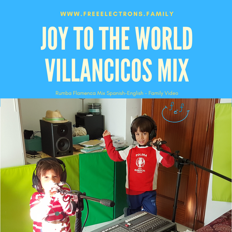 Two young boys with headphones and microphone in a home recording "studio".

Text reads:  Joy to the World, Villancicos Mix, Rumba Flamenca Mix Spanish-English-Family Video.

www.FreeElectrons.Family